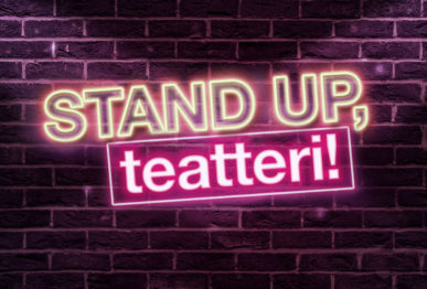 Stand up, teatteri -teksti neonkirjaimin tiiliseinää vasten